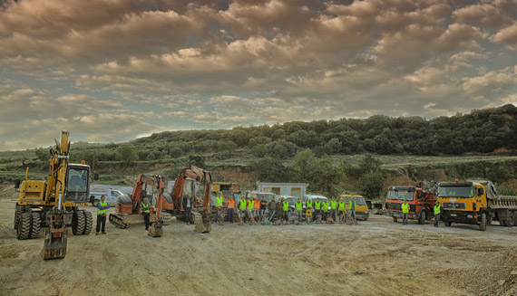 Machinery, Instruments, trucks and workers in a building site ready to get to work